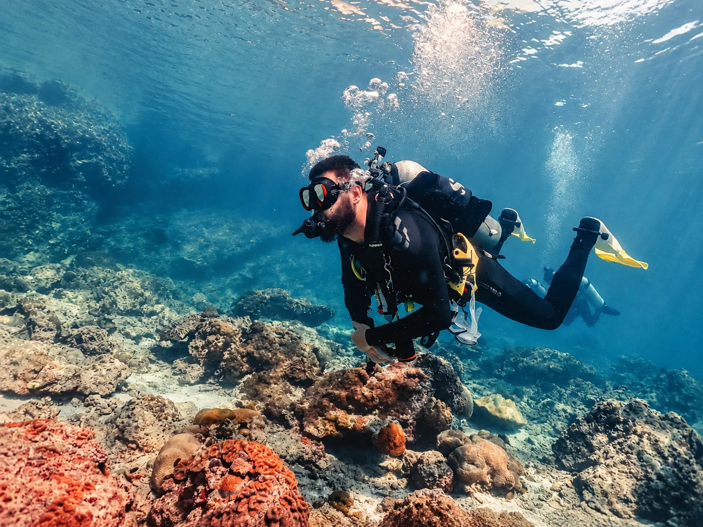Ondra diving over a coral reef
